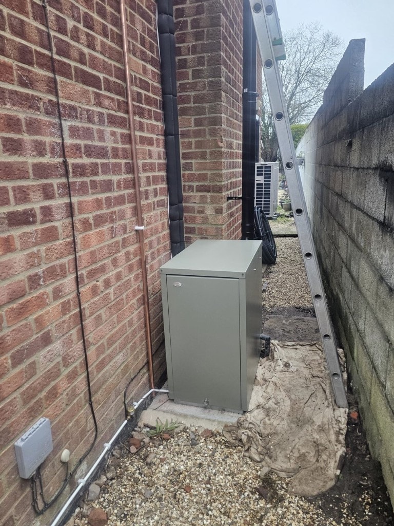 Grant Vortex external oil boiler installed in a side passage with copper pipework by APS